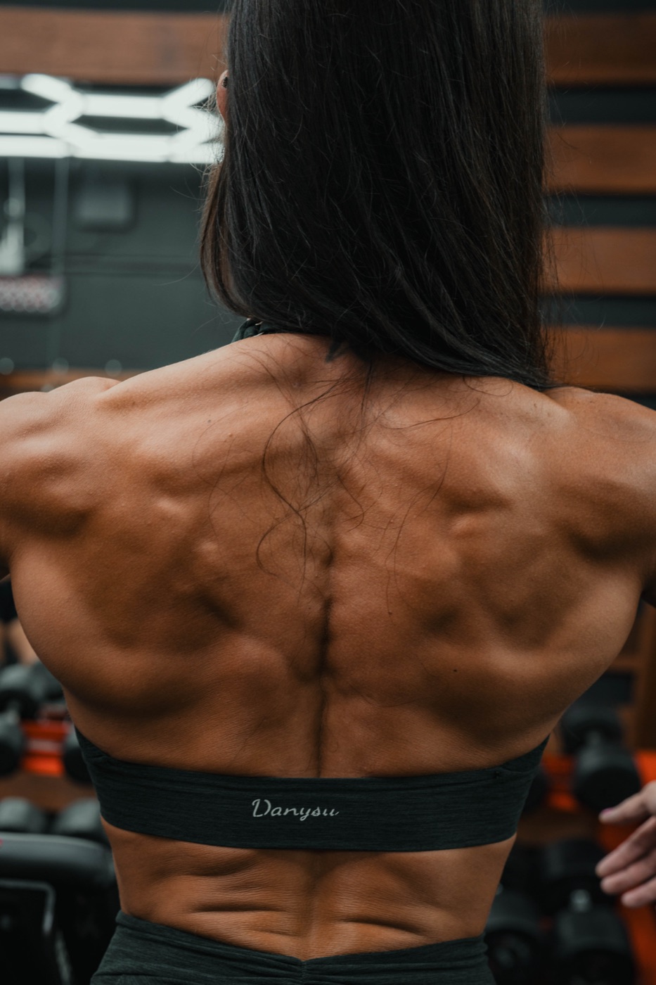 Back double biceps pose at Flex Fitness